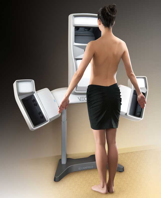 small breast implants patient model getting her breasts scanned at the vectra 3d imaging equipment